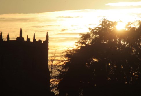 golden sky with church tower